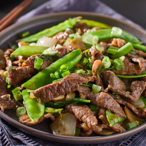 Quick frozen un-aged grass fed beef stir-fry with tarragon, garlic, ginger and pink pepper